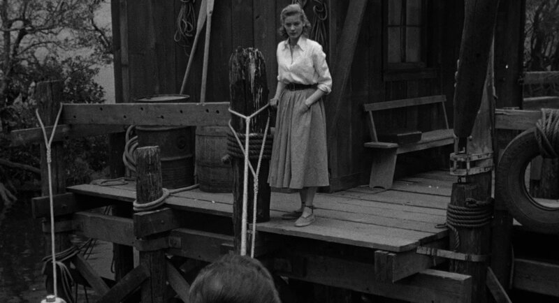 Lauren Bacall on a dock