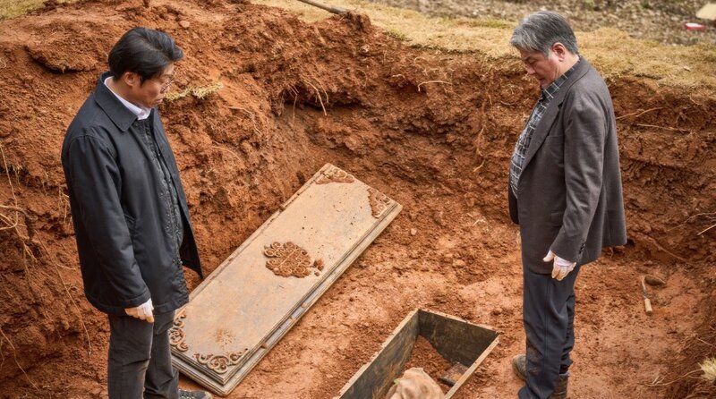 two men and a coffin