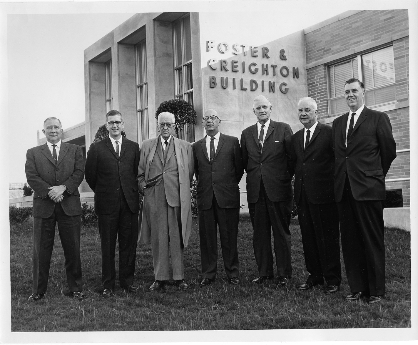 Executives of the Foster & Creighton Company in front of the Foster & Creighton Building
