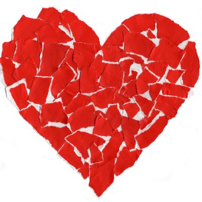 A red heart that has been ripped up and the pieces put back together