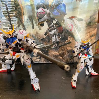 A Master Grade (left) and High Grade version of the ASW-G-08 Gundam Barbatos Gunpla